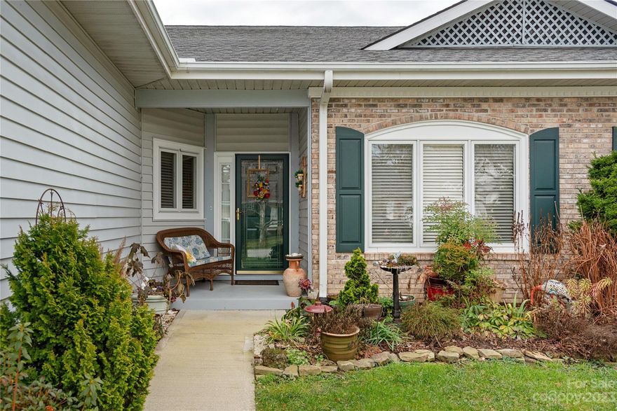 GREAT location!!!! This spacious 2 br/2ba condo is all one level !!, open great room,  split bedrooms, gorgeous fireplace, enclosed sunroom, and one car garage are some of the features. Don't miss this comfortable and convenient unit just minutes to downtown Hendersonville shopping and dining!!!