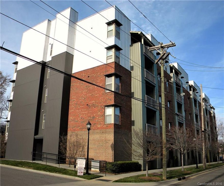 Own your slice of an amazing Uptown neighborhood!  Wesley Heights has seen extraordinary growth and more is to come!  You are warmly welcomed with fresh paint, hardwood flooring in kitchen, dining, and living areas.  Tile shower and bathroom with stacked washer/dryer included! All electric appliances; HOA includes water/sewer, trash, and common area maintenance. Elevator in building with secured access. Walk to Panthers and Charlotte Knights Games, Uptown restaurants and entertainment!