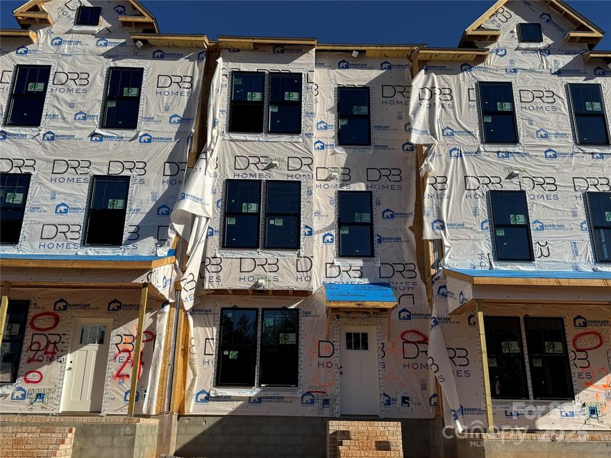 Brand New! The LAST available townhome in Ballantyne's most affordable new construction neighborhood. The Landon plan is a 3-story townhome that boasts 3 bedrooms with 2 primary suites 3rd level, 3.5 baths total, bedroom & bathroom on 1st floor and 2-car rear-load garage! Walk up the stairs to your light & bright second level where you’re greeted by a spacious great room & Gourmet Kitchen featuring an oversized island, SS appliances, 5-burner electric drop-in cook-top, wall mount range hood, wall oven & wall microwave, tile backsplash & SS undermount sink. The perfect space for entertaining! Each of the 3rd level suites feature large walk-in closets with dual sinks, tile floor, walk-in tile shower with semi-frameless glass door & tile seat. Laundry on 3rd. Water & Sewer & Trash are included in HOA dues. Location, Location! Ask about our flex cash toward closing costs/prepaids with approved lender. Completion in January 2026. Middle Unit