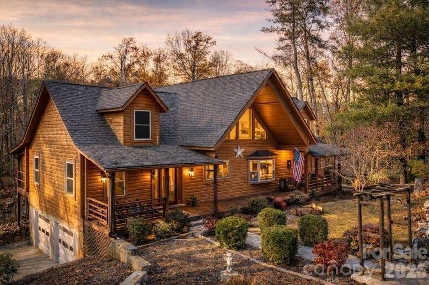 Perfectly secluded with a perfect blend of rustic charm and modern appeal. 143 Rosewood Ln is a 2988 heated sq ft log home sitting on 5.12 acres, consisting of 2 main level bedrooms, 1 bonus/bed in the basement and 2 full bathrooms on the main level. The blend of log, wood and painted drywall cause this home to feel open and expansive. Speaking of that, the vaulted great room with loft and wood burning fireplace is expansive as well. Large, covered and screened porches extend across the front and rear of the home giving ample outdoor living space for those beautiful foothills days. The logs were recently re-stained in 2024. Pergo flooring installed in main living areas in 2024. Granite kitchen counters installed in 2025. Two water heaters replaced in 2019 and a toilet added downstairs in 2019 in an area that could be finished out for a full bathroom. Don't miss it! $549,900