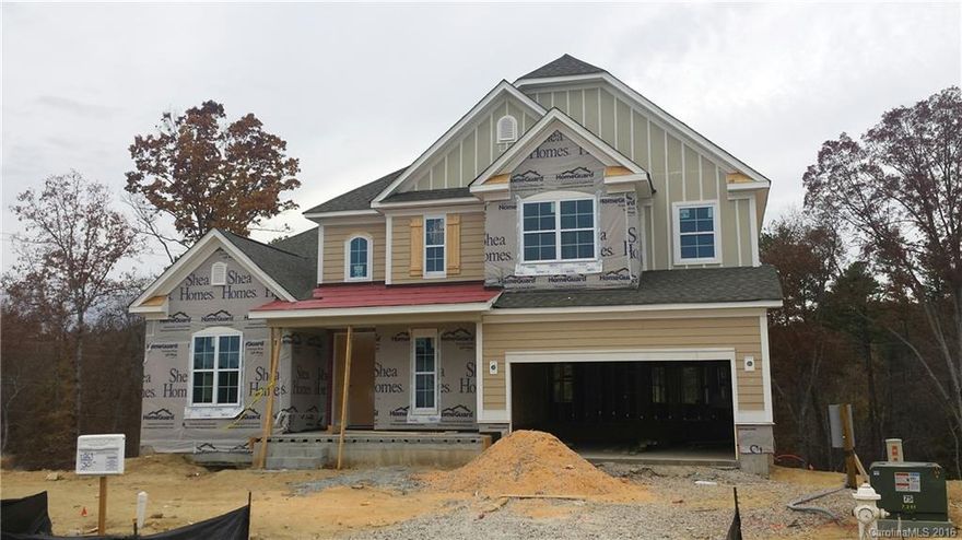 This beautiful home features an exterior of painted siding, stone & timber accents. Guest Bedroom w/ a Full Bath on main. Dining room w/ soaring 12' ceiling. 1st floor Owner's Suite w/ picture window, tray ceiling & bathroom w/ lots of counter space, separate shower, garden tub, tile floors & surround + quartz counters. Family Room has gas FP w/ built-in media niche cabinets & shelving.  Finished walk-out basement w/ large leisure room & powder room plus unfinished storage. 2nd floor Rec Rm.