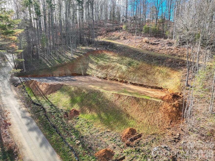 Ready-to-build and perfectly positioned lot just off US Hwy 19E. 
Bring your home plans and take advantage of an exceptional setting that offers the ideal blend of privacy and convenience—this eastward-facing lot is perfect for sipping your morning coffee while watching the sunrise.
Enjoy the relaxed pace of mountain living while staying close to everything you need.
Situated on the sought-after west side of Yancey County and only 3 miles from charming downtown Burnsville, you’ll enjoy effortless access to boutique shopping, fine dining, and a variety of local amenities.

Don’t miss this great opportunity to build your dream home in a prime and growing area!