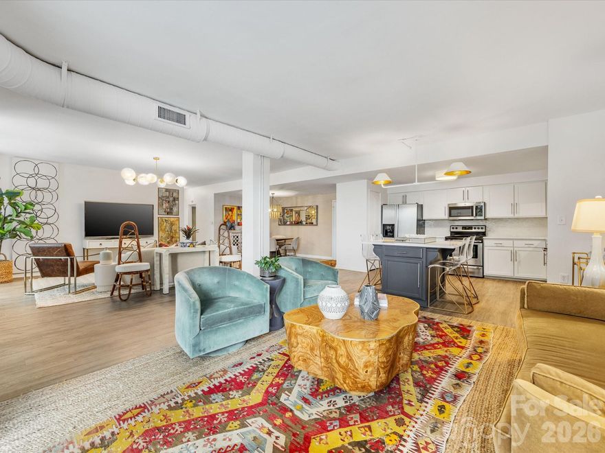 Bright, expansive, and exceptionally rare — welcome to Residence #200 at The Kimberlee, Myers Park’s iconic Art Deco co-op!

Offering an oversized 1,656 square feet — a true rarity in this building — this loft-like home has been thoughtfully reimagined into a sophisticated two-bedroom/1.5 bath retreat. Sunlight pours into the open-concept great room, where tree-lined views and an airy layout create an atmosphere that feels both elegant and serene. Two private balconies invite morning coffee above the canopy and golden-hour sunsets overlooking one of Charlotte’s most beloved neighborhoods. Privately positioned at the far end of the residence, the primary suite is wrapped in high-end designer wallpaper and features a generous walk-in closet with future potential for a second full bath. The guest room includes a custom Murphy bed that offers seamless flexibility for guests or a stylish home office. Recent designer updates — including new appliances, fresh paint, and elevated lighting fixtures — enhance the home’s timeless character while delivering modern comfort.

Life at The Kimberlee is truly turnkey. Amenities include deeded parking, 2 private storage lockers, resort-style pool, Sky Lounge with full kitchen, guest suite, fitness center, community garden, and a private owner’s bridge providing direct access to Park Road Shopping Center. Freedom Park and the Greenway are just moments away.
The monthly HOA covers property taxes, water, sewer, cable, Wi-Fi, and building maintenance — offering simplified, lock-and-leave living in one of Charlotte’s most coveted neighborhoods.