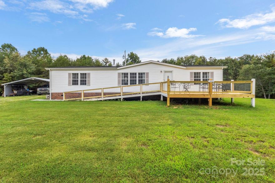 3 bedroom, 2 bathroom 27x60 manufactured home located on 7.53 (+/-) acres of wooded land. The owners recently updated the flooring with nice laminated wood floors in the kitchen, living room, hallway, and laundry. There is a freestanding wood burning stove which offers an additional way to to warm the home. There is a 2 car detached carport for additional parking and storage, 2 wired storage buildings with lean-to sheds, as well as a fenced in backyard. The home has a nice mudroom addition on the back of the home and large deck with a ramp on the front. The home is located just outside of the city of Polkville, NC. It is close to town but offers lots of room and privacy with a country feel. The homeowners stated that there is a natural spring and small creek on the property with abundant deer, turkey, and other wildlife frequenting the property. This property want last long so schedule your showing today.