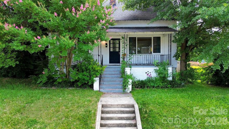 Own a charming piece of Gastonia history just a short walk from the FUSE district and Loray Mill. This 1900-built cottage features a welcoming covered front porch, classic hardwood floors, an open floorplan, and a spacious kitchen with cottage-style cabinetry, butcher block counters, a farmhouse sink, and vintage-inspired fixtures. Both bedrooms offer walk-in closets, and the large attic provides potential for additional living space. This home qualifies for $20,000 in lender assistance for closing, down payment, and rate buydown, offering a great opportunity for buyers. Schedule your showing today!