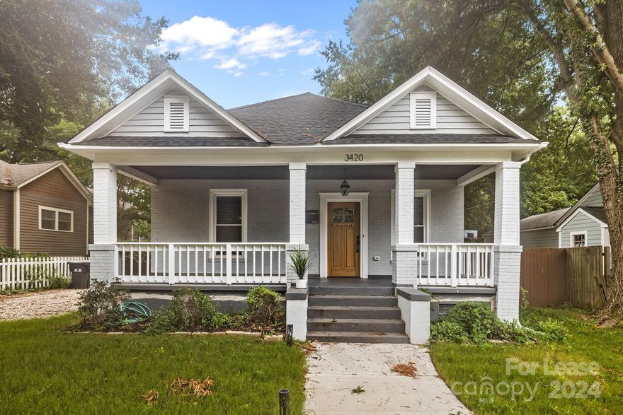 Are you looking for a home in a quiet street surrounded by trees and near the desirable NoDa Arts District? This wonderful bungalow home has an open floor plan with well-maintained flooring, three spacious bedrooms, two full bathrooms, and a walk-in primary closet. The kitchen features quartz countertops, recessed lighting, modern white cabinetry, and a classy farmhouse sink. 
Enjoy the big outdoor entertaining areas in the rear or on the front porch, which have room for your little ones to play! Live in a neighborhood with excellent walking access, the light rail, and local parks. The home is in a great spot where you can find any stores, eateries, bars, or coffee shops you might need, just wander around Davidson Street and enjoy the live music that NoDa is known for.