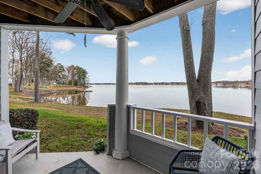 Ground floor 2 bedroom waterfront condo in the Edgewater complex of Davidson Landing. Great location and lake view. Easy access 1st floor condo. Updates include kitchen cabinets, countertops, and LVP flooring throughout. Both bathrooms have been updated. Primary bathroom has walk-in tiled shower and updated vanity. Fireplace has been upgraded to an electric insert. Smooth ceilings and crown molding. Windows and the sliding door have been updated. Walk right off the waterfront porch to the community pool and pier/dock. Short walk to boatslips, restaurants, and community amenities. Community provides leased boatslips, pickleball, tennis, pool, walking/fitness trail.