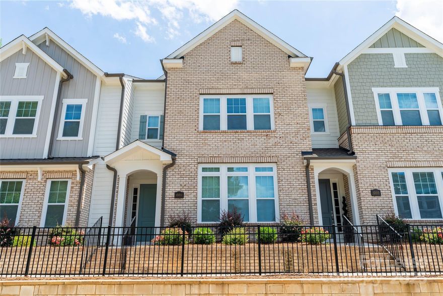 1.5 mi from Ballantyne Corporate, Modern 2-story townhome in SouthRidge built in 2020. Includes large open gourmet kitchen (Gas cooktop, gleaming stainless steel appliances, upgraded quartz countertops, white cabinetry with soft-close drawers), large family area w/ upgraded FP, downstairs bedroom with a FULL attached bath, and a separate Powder room (half bath) on 1st floor. Outdoor Covered & Fenced courtyard. Attached rear-entry 2-car garage with keyless entry-pad opens to a convenient drop zone. Beautiful hardwood staircase to spacious owner's retreat (loft) with an inviting sitting room. LARGE Master BR with attached luxurious spa bath w/oversized super shower plus 2 LARGE walk-in closets & upgraded Quartz countertops! Tons of Storage Space. 2nd floor has the laundry room with a washer, dryer, folding area. RENT INCLUDES Lawn maintenance, HOA Fee & Water Bill. Only a few minutes away from I-485, Morrison Family , BCC, & restaurants. Min 1 year lease, ready to move-in Feb 1, 2025.