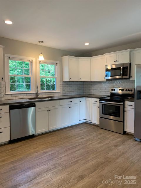 Photo of 711 Riddle Street, Mount Holly, NC 28120 (MLS # 4309602)