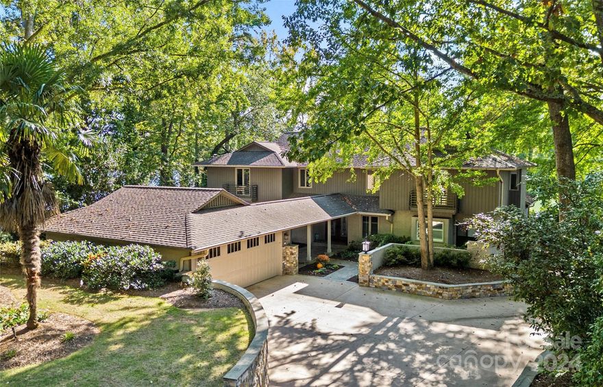 Waterfront luxury living at its finest in River Hills, a gated golf and country club community. Desirable open and bright floorplan allows for effortless entertaining. Show stopping full kitchen renovation (2021) includes double islands, quartzite counters and luxury appliances. Impressive lake views from great room, sunroom, breakfast area & porch. Gas log stone fireplace & built-ins anchor the great room creating a warm living space. New skylights in sunroom offer all day natural light. Primary bedroom & office on main level. Three additional bedrooms, two fully renovated bathrooms, fitness room & loft upstairs.  Extend entertaining outdoors on the tiered deck, patio with gunite pool and travertine decking as well as on the flat lot & small beach. Well maintained pier, dock and covered boat slip with lift to immediately enjoy lake living. Two car detached garage with covered bluestone walkway into home. Well dedicated to yard irrigation. Third floor walk-up attic offers easy storage.