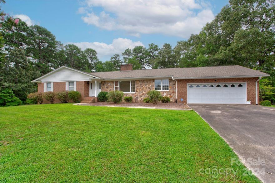 Well maintained and super clean ranch with secondary living quarters!  Upper level includes kitchen, large family room with fireplace, dining room with French doors, living room, separate laundry room and storage, primary bedroom with its own bath, plus 2 secondary bedrooms sharing a second full bath.  Lovely sun porch with stone floors and large deck overlooking the private serene backyard.  Lower level features an additional 1400+ heated  area with bedroom, full bath, large den with fireplace, and roomy kitchen and dining.  This lower level also includes a 1 car garage and  exterior entrance with patio.  No need to access upper level.  In addition to these features, there's  unheated basement footage of approximately 700 sq ft.  This property includes 2 lots with total of 1.5 A.  POSSIBILITY to redraw lines for SEPARATE BUILDING LOT per City of Kannapolis and Restrictive Covenants.  See attachments and call seller's realtor for additional details.