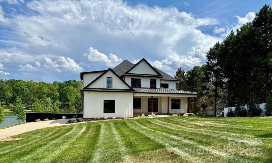 Custom Troutman estate featuring 6 bedrooms and 6 bathrooms on a beautiful 1.3 acre waterfront lot with stunning Lake Norman views. Well equipped Chef's kitchen with a main level open concept.  There is an expansive outdoor entertaining space with covered porches on the main level. A walk out basement that leads to an in-ground pool with jacuzzi.   An under roof total of 9697 sq ft with the expansive porches!  The builder permitted  the dock with Duke Energy through Lancaster Docks, but the permit has expired.  Builder will provide all info to help renew the permit.  The Builder is offering a 50,000 ALLOWANCE FOR THE DOCK. 
(Please note there was a recent street name change where this home is located.  Google maps will reflect the new name,  Zwilling Court)
