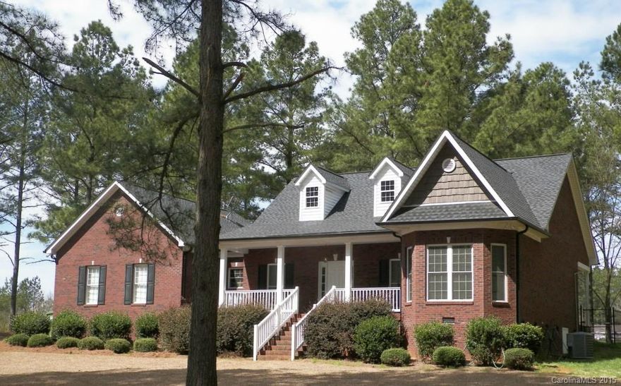 Don't miss this attractive home that is nestled behind the tall pine trees on this spacious 1.40 acre lot.  This brick home features a covered front porch, rear fenced yard, attached two car garage, family room with FP and access to the back yard. The kitchen features stainless stove, microwave and dishwasher with dining area.  The split floor plan offers privacy to the master bedroom and bathroom. There is no wasted space in this house! Sit on the porch and enjoy the lovely landscaped yard.