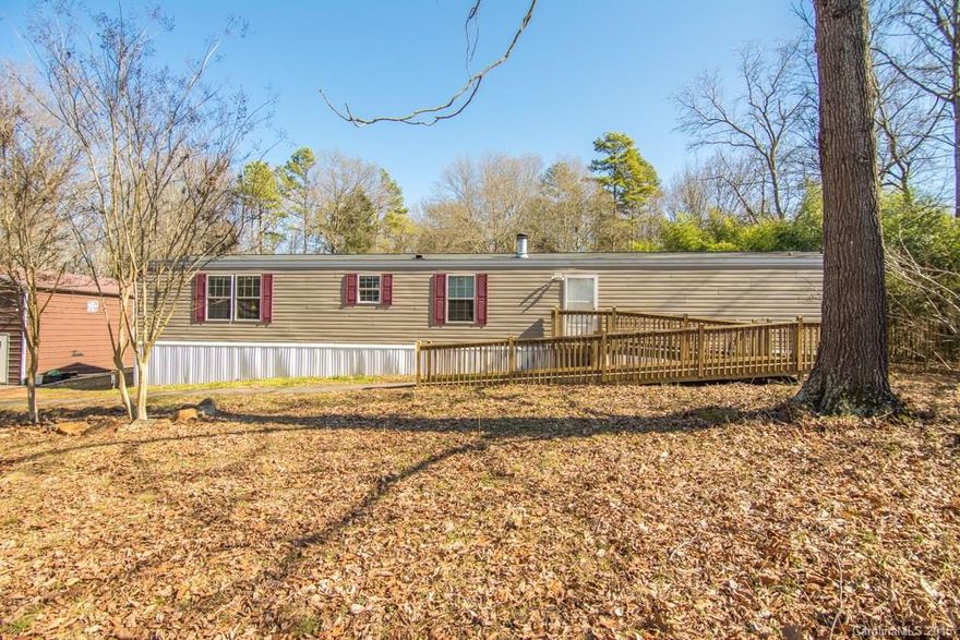 Check out this house located on a wooded 1.02 acre lot in a great location with privacy. It features a ramp into the home, wide doors, tape/textured drywall, wood burning fireplace, and an open floor plan. GE Profile Stainless Appliances, upgraded wiring, small storage shed, septic/well, hurricane straps, upgraded energy efficiency, and a 16 ft garage w/ loft (wired with 220 Volt).