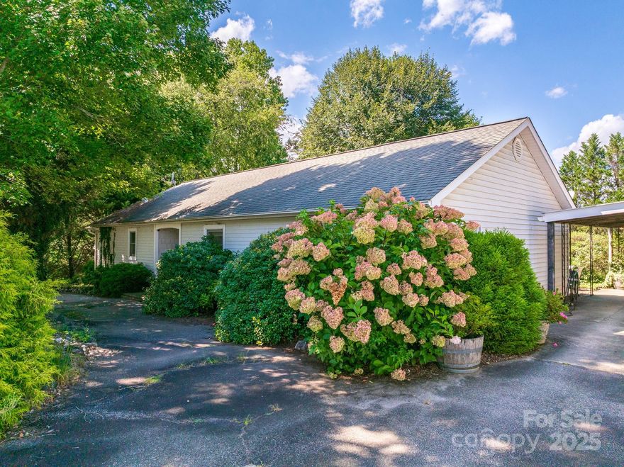 Oustanding investment and multi-use opportunity! This versatile 1.82 acre property features a main residence, guest cottage and 30 storage units, offering excellent potential for rental income, a home-based business or multi-generational living. The main home includes 3BR, 2BA, a spacious floor plan, bright sunroom, convenient laundry area and a screened porch off of the primary bedroom. The 2BR, 1BA cottage offers a cozy layout with a private back deck. This home is ideal for rental income or extended family accommodations. Perfectly situated close to shopping, dining and Interstate I-26. This property combines prime location convenience with a peaceful park-like setting. The 30 storage units provide additional income for personal or business needs.