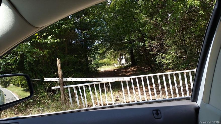 Please do not walk on property without an appointment.  Seller lives next door  at corner lot and has dogs 
guarding land.......Property had a fire on it  four year ago, has a 36 x 36 concrete pad and a well and septic tank

Property had a Manufactured home and gar

At closing seller will pay her contractor to clear the debris  from fire on property. 
The corner property at Aziza and Gordon is for sale.