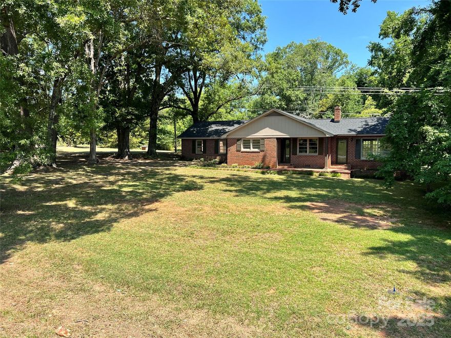 A Hobbyists Paradise! This is a rare opportunity to own 21+ acres with a pond, 2 shops both with power one with an office, 1/2 bathroom and overhead door, a storm shelter, outbuilding and all while still being close to nearby amenities. This remodeled one level brick ranch offers new waterproof laminate flooring and paint throughout, new HVAC and roof, remodeled bathroom and beautiful granite counters in the large country kitchen. A warm and welcoming den that leads to a bright and sunny sunroom are perfect for family gatherings. The possibilities for a hobby enthusiast or small business owner are endless!

Back on the market due to no fault of the seller's or defect in the property.