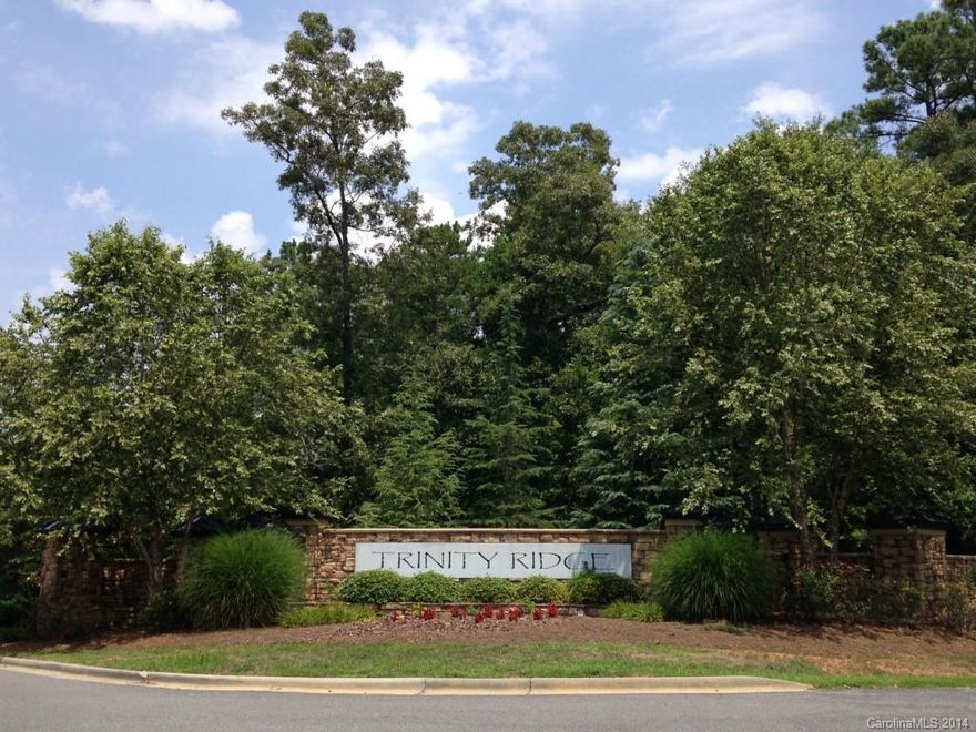 Amazing wooded 5.55 acre property has all the benefits of living in the premier Fort Mill custom home neighborhood, Trinity Ridge, with the added advantage of not being subject to the Trinity Ridge HOA.  Layout of the land allows for a the flexibility of a prominent or very private setting.  Can also be further subdivided.