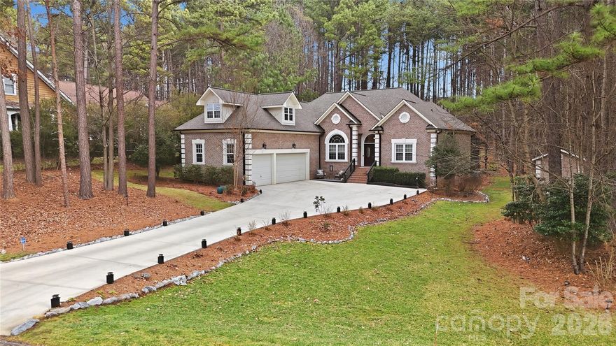 Back on the market Now Featuring an Open concept Kitchen and living room.   Big beautiful kitchen island.     Deeded boat slip with lift!
Beautiful custom built home on very private lot with DEEDED Boat Slip.  Year round views of Lake Norman. Very private backyard.
This home has been renovated from crawlspace to gutters within the last 4 years.  Upgrades include: New open concept kitchen with large island, encapsulated crawlspace in 2021, Central Vacuum, ALL new LG appliances in 2021 with pot filler at stove and disposal in sink and new tile floor.  Custom woodwork/shelving in both his and her walk in closets.  Bedroom 2 and 3 with Jack and Jill bath. Upstairs flex room has a closet for additional storage or possible 4th bedroom. Tankless water heater 2021.  New gutters with covers 2021.  Upstairs HVAC replaced (by original owners) 01/2020 with a 10 year extended warranty through 01/2030.  Septic tank pumped/cleared 2021. Garage floor epoxy 2025.  Amazing covered/screened in room with tiled flooring and a new outside fireplace and hot tub.  Large cement patio with trellis area currently covered with a sun shade makes for the perfect backyard entertainment area.  Pool in back yard approved by HOA and the town of Iredell.