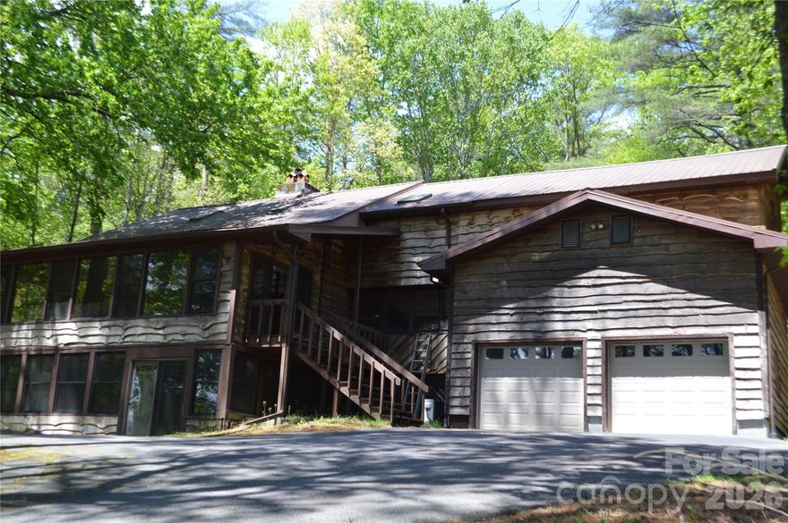 Wonderful custom built wooden home on 3+ private, wooded acres. three large open family gives space for everyone. Would be perfect for an extended family mountain retreat. Circular driveway with plenty of parking. Two car attached garage as well as a two car carport. Borders game lands so there is no worry of nearby future development.