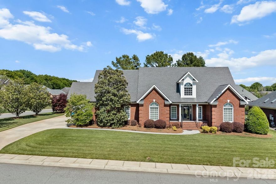 For the first time offered, this custom-built builder’s personal residence showcases exceptional craftsmanship, thoughtful upgrades, and meticulous maintenance throughout. Located in desirable Morris Glen, this beautifully maintained home offers approximately 3,477 total finished square feet, including a detached garage apartment, providing flexibility for multigenerational living, guests, or private workspace needs.
Situated on a meticulously landscaped corner lot, the full tumbled brick exterior with elegant coin accents creates timeless curb appeal, complemented by palladium front windows, a welcoming front porch, and a rear patio finished with flake epoxy coating and silica for added traction and durability. The fenced backyard is designed for outdoor enjoyment with natural gas plumbing already in place for your grill, mature magnolia, Japanese maple, crape myrtle, and dogwood trees, plus a well ready for a full-yard sprinkler system. Additional exterior features include underground utilities and downspouts, a 50-year architectural roof with recently replaced boots to help eliminate leak risks, and updated exterior locks and handles within the past year.
Inside, the main home features an open split-bedroom floor plan accented by impressive 8-foot baseboards, plantation shutters throughout, and extensive recent updates including new pet-friendly carpet and pad, new tile flooring, new toilets, and all-new stainless steel appliances. The grand entryway welcomes you with beautiful hardwood floors, decorative plant shelves, and a foyer ledge featuring a light switch-controlled electrical outlet perfect for seasonal décor or accent lighting.
The dining room offers hardwood floors and a vaulted ceiling, creating an elegant setting for entertaining. The spacious kitchen features granite countertops, all-new stainless steel appliances, and excellent flow into the main living areas. The great room is truly the centerpiece of the home with custom built-ins, a traditional masonry fireplace with gas logs, recessed lighting, and an impressive 18-foot vaulted ceiling that enhances the open feel of the space.
The main-level primary suite offers privacy and comfort with an 11-foot tray ceiling, walk-in closet, and ensuite bath. Two additional bedrooms are also conveniently located on the main level. Upstairs, the fourth bedroom features a vaulted ceiling and full bath, making it an ideal guest suite, bonus room, or private retreat.
Adding tremendous versatility, the detached garage includes a 674 square foot all-electric apartment complete with its own private entrance from the garage, laundry area, kitchen, living room, full bath, walk-in closet, and additional storage space.
Morris Glen residents enjoy excellent community amenities including an outdoor pool, gaming court, tennis court, and playground area. Conveniently located in southwest Concord, the neighborhood places you just a short drive from Concord Mills, Charlotte Motor Speedway, and major employment and retail hubs along I-85 and I-485. University City and the greater Charlotte area remain easily accessible, while everyday conveniences including grocery stores, restaurants, and local services are only minutes away. Buyers will also appreciate access to Cabarrus County schools and the balance of peaceful residential living with close proximity to regional amenities and commuter routes.
