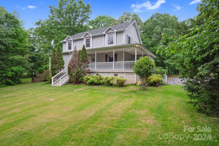 Beautiful setting for this Peaceful Retreat! Enjoy the sounds of nature on this 1.47 acre home surrounded by mature  trees and privacy with no HOA. This 2 Story Basement Home offers 5 bedrooms, 2.5 bath, beautiful wrap around porch and a private deck w/ scenic views. Primary bedroom on the main level with walk in closet, Spacious eat in Kitchen, Open floor plan, oversized Great room, Laundry on the main, 4 large secondary bedrooms upstairs. The basement is an open space to be used for whatever you desire. This is a quiet established neighborhood, close to Award Winning Clover Schools. Relax on the rocking chair front porch and call it home.