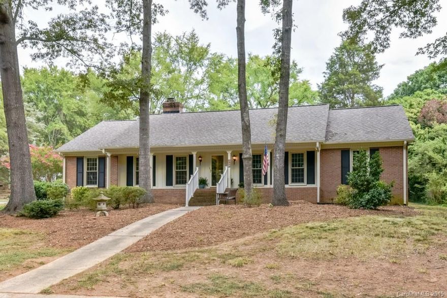 Pristine 4bdrm,spacious brk ranch,near S.Park & Uptown. Tree lined streets,lush priv. lot, lg foyer,new carpet in formal L/rm & dining/rm, sparking wd/flrs. Granite & ceramic tile in kitchen. Lg family rm. w/stately angled Fireplace. Lg. Laundry, fresh paint, Lovely pela windows, pocket doors, full floored attic. Outside work shop, lg separate storage area, 24' patio, Well designed bricked 2 car carport. Ample parking.   Washer/dryer & refrigerator remain.Designed for a life time! 1 yr.Warranty!