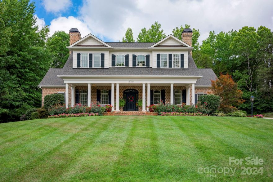 Discover 15328 June Washam Road, Davidson, a beacon of traditional charm and modern comfort. Nestled in a coveted neighborhood, this distinguished home exudes sophistication and warmth. Inside, classic architectural details, hardwood floors, and custom millwork create an atmosphere of refined luxury. The gourmet kitchen boasts premium appliances and ample prep space, perfect for culinary delights and family gatherings. Multiple bedroom suites offer luxurious accommodations, each designed for comfort and privacy. Serene living spaces, flooded with natural light and framed by picturesque views of meticulously landscaped grounds, provide a peaceful retreat from the bustle of daily life. Retreat to the peaceful master suite on the main level for ultimate relaxation. Step outside to the expansive patio, surrounded by mature landscaping—a serene setting for outdoor entertaining or quiet moments. Experience the enduring beauty and comfort of traditional living at 15328 June Washam Road.