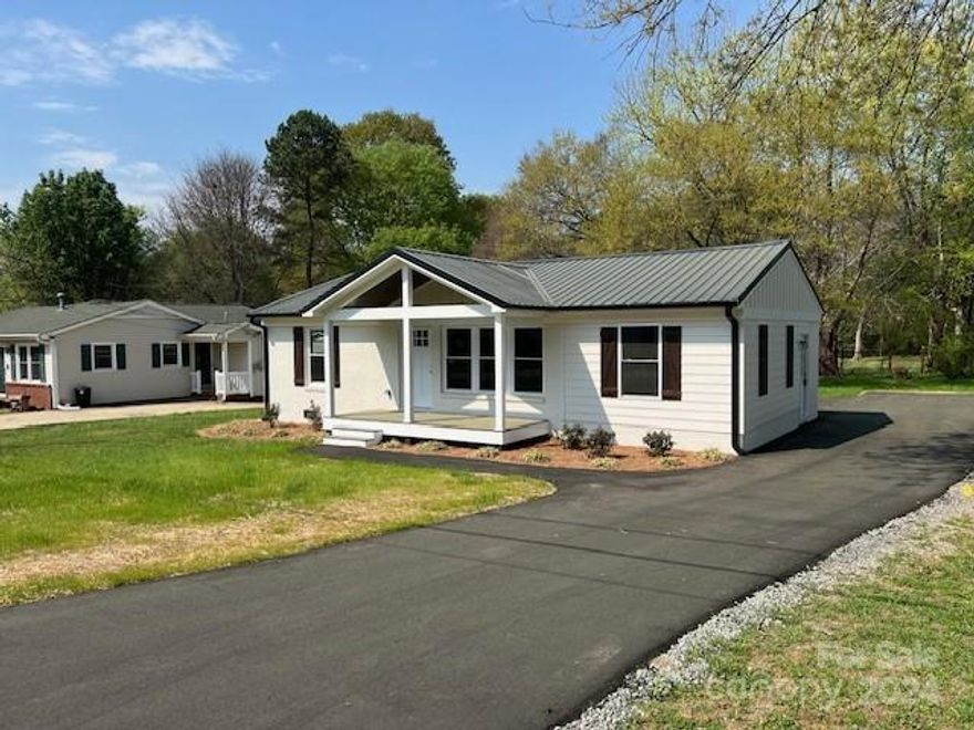 Lovely 2 bedroom home.  Renovated from the frame.  New wiring, plumbing, hvac, roof, windows kitchen.  Oversized driveway with ample parking.  House is like new.  Ready for new owner.  All repairs permitted and inspected.