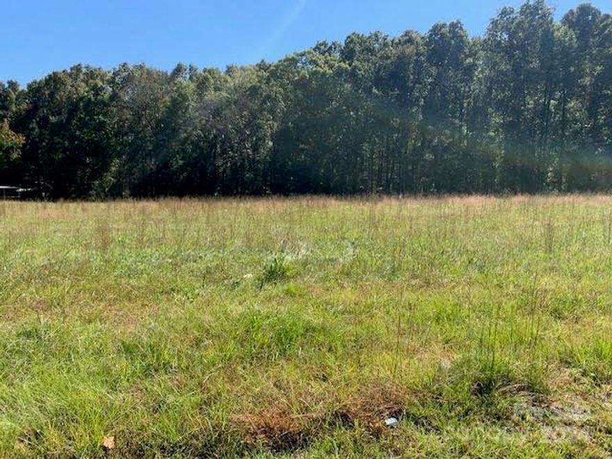 Here is your NO HOA building lot that is 2.33 acres. This is 50% of the parcel amount. More land is available for sale.  We have a 5 acre tract also listed same location. This land is 1 mile from Hwy 274 in Lake Wylie. This property has County water available at the street or you could drill a well.  Buyer will be reasonable for getting your own perk test and new survey at your own cost.  York County to approve all new parcels.
County Zoning: RUD.     Land is partially cleared but also wooded maybe 60%. Clover Schools.