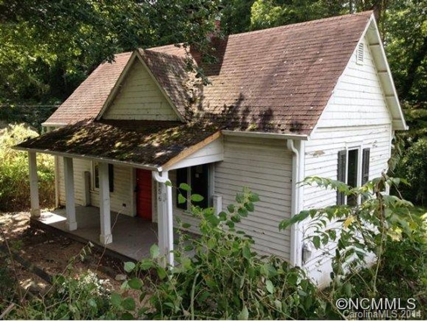 Cute bungalow/farmhouse in North Asheville. Extremely convenient to Merrimon Ave and all dwtn Asheville has to offer.  Home has a ton of character and features wood floors, a living room w/ wood stove, covered front porch, level corner lot suitable for small garden, and laundry in bsmt (suitable for storage).