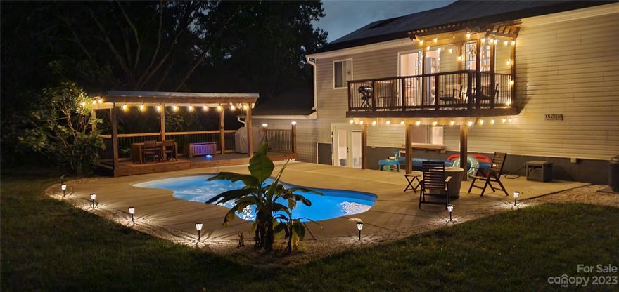 Nestled in the heart of Harrisburg on .46 acres, this stunning home exudes a timeless charm that combines modern amenities with rustic elegance. Upon entering, you'll immediately be drawn to the warmth and coziness of the vaulted wood ceilings and accents throughout the living spaces. 
The thoughtfully designed kitchen features granite countertops, tile backsplash behind the range, open shelving and tons of natural light. 
Entertaining takes on new dimensions with the bar area on the bottom level giving way to the breathtaking backyard oasis, complete with a beautifully heated pool with saltwater chlorine generator and gazebo area. Whether it's hosting poolside gatherings or enjoying a peaceful swim on a tranquil afternoon, this space caters to your every desire.
Home also features solar panels and tree-lined fenced in backyard. You don’t want to miss this!!!