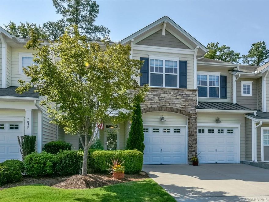 Former model home with open main level floor plan with 5" dark harwoods. Large island kitchen with breakfast bar - tile floors in kitchen - eat in area that overlooks private wooded rear.  Converted loft /office with built-ins plus large master suite and laundry upstairs.  Two car garage with double driveway - opposite visitor parking