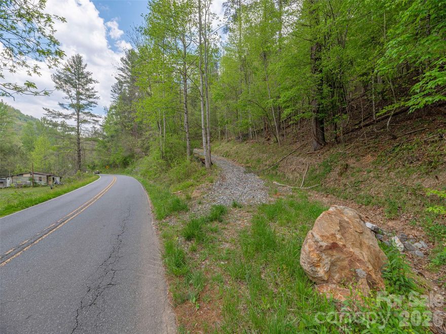 Who says you cant have it all? Find your very own slice of paradise in the beautiful mountains of Western North Carolina. Located in the tranquil setting of the Caney Fork Community experience Peace at its finest! This unique opportunity will allow you to build your own Mountain Estate or Family Neighborhood on Unrestricted Acreage. Multiple build sites are around you with a newly cut road to be able to access it all. Immaculate Mountain Views are what you will be able to enjoy with beautiful Western Sunsets. Your plans will fit here comfortably no matter the size. There is an abundance of Wildlife, Trout Streams, and Rivers all around you and a running spring on this property. Carve your own trails and write your own mountain story!