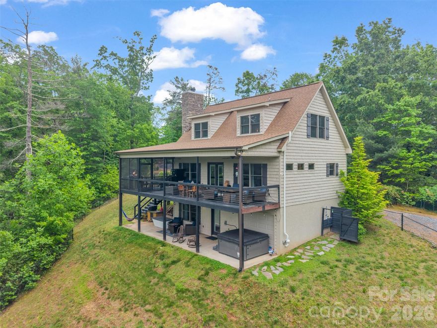 Tucked away in a secluded private cove on Lake Lure, this extraordinary lakefront estate offers a rare sense of escape where luxury, nature, and thoughtful design come together in perfect balance. Set on more than 8.5 acres of wooded landscape, the property unfolds with intention: winding trails, sweeping lake and mountain views, and curated outdoor spaces invite you to slow down and fully take in your surroundings. It’s a place where mornings feel peaceful and unhurried, and evenings unfold beneath expansive, star filled skies. Inside, the home has been completely reimagined with a designer’s eye, blending elevated rustic textures with clean, modern comfort. Offered fully furnished, each space is layered with rich materials and timeless Ralph Lauren accents that create warmth without sacrificing sophistication. The flow of the home is both welcoming and functional, featuring a primary bedroom on the main level and additional sleeping quarters upstairs, which make hosting effortless and comfortable. Beyond the interiors, the experience continues. A private boathouse offers direct access to Lake Lure (NOW OPEN!)