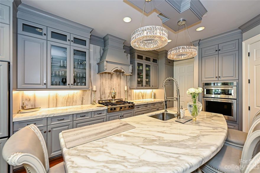 Stunning, gated 4 br/ 4 1/2 bath condo in the heart of Myers Park. Recently renovated with gorgeous kitchen featuring Carrera Gold marble countertops & newer appliances.  A new elevator, 2 new full baths and an amazing new finished 3rd floor with 11” ceilings. The private bricked courtyard with lush landscape is the perfect setting for entertaining. High ceilings and hardwoods; Gorgeous coffered ceilings and patio off the master to enjoy your coffee or cocktail at sunset. New HVAC for upstairs.  You do not want to miss this crown jewel in Charlotte! Showings start Thursday April 20th.