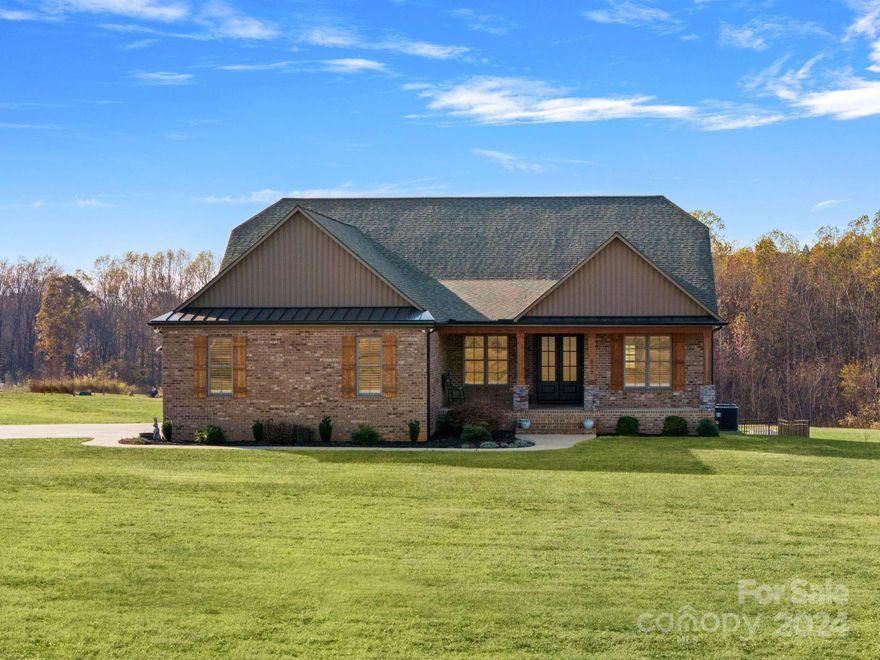 Looking for a place with plenty of open space to spread out and enjoy the country air, look no further.  This gorgeous home nestled on over 14 serene acres boasts an inviting exterior with well-maintained landscaping and an expansive outdoor space perfect for relaxing or entertaining. Inside, you'll find a spacious layout with modern amenities featuring an open living area. A well-appointed kitchen features professional-grade appliances, an induction cooktop, double ovens, an oversized side-by-side refrigerator and freezer, an ice machine, and quartz countertops. The primary suite is spacious and filled with natural light. The property also includes a fully finished basement with a second living quarter complete with a full kitchen, laundry room, and separate garage. Located in a peaceful area, yet conveniently close to local amenities, this home offers the perfect blend of tranquility and accessibility. Don't miss the chance to make this delightful residence your own!