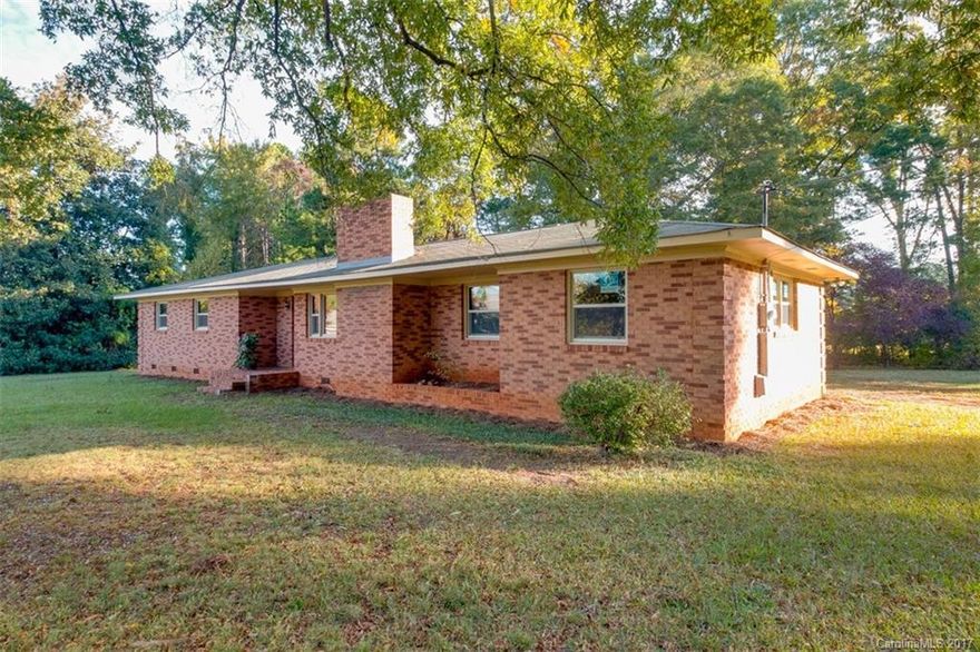 Updated brick ranch home on a large corner lot w/hard wood,  NEW vinyl laminate floors.Conveniently located for easy access to Matthews, Mint Hill, and Uptown Charlotte. Kitchen updates include revitalized cabinets with modern pulls, new counter tops, and flooring, plus new light fixtures, new windows, new garage door, new deck and fresh paint throughout. Wood burning fireplace in the living room. You must see this wonderful transformation!