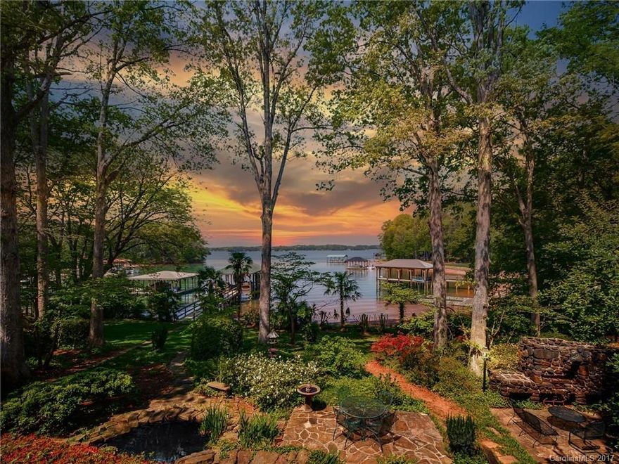 What a great price for an Upper Jetton Road waterfront basement lot perched on approximately 1.18 acres of prime Lake Norman real estate! City water & sewer available, lushly landscaped gardens with towering hardwoods, outdoor stone fireplace, koi pond & newly renovated covered dock. Huge new detached garage "barn" has enough room for the largest RV and then some. Existing home has tons of charm & local history with its sweet stone fireplaces, custom kitchen brickwork & heart pine floors. Sweet!
