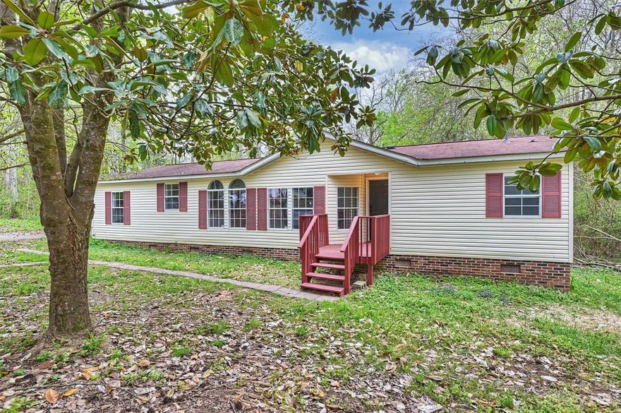 Wonderful opportunity for this recently renovated home that sits on an oversized 1.25 acre lot. With 3 bed and 2 full bathrooms, this home features new flooring throughout, updated kitchen with white cabinets, new granite countertops, new stainless appliances, updated bathrooms, modern light fixtures throughout, great room with fireplace, oversized primary suite with en-suite bathroom, dual vanities, garden tub, separate shower, detached carport, New roof installed Aug 2023, and so much more!