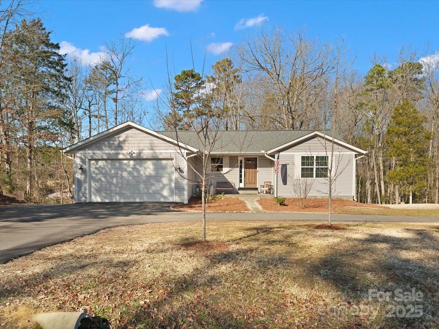 Like new 5 bed 2 bath located on a cul-de-sac street and NO HOA. Home features an open floor plan,vaulted ceilings and laundry room on main level with deck overlooking the backyard. The primary bedroom on the main level features walk in closet. Walkout basement offers living area ,2 bedrooms , storage area, weight room and small office area,with direct access to the back yard. Beautiful fireplace in the main living area that flows to kitchen with island. Outside you'll find newly paved circular driveway with storage space for boat or RV also paved. Attached front load garage adds more convenience for unloading in weather. The home has vinyl plank flooring throughout the home. Very hard to find 5 bedrooms in the Clover School district at this price. Make your appointment today. No HOA !