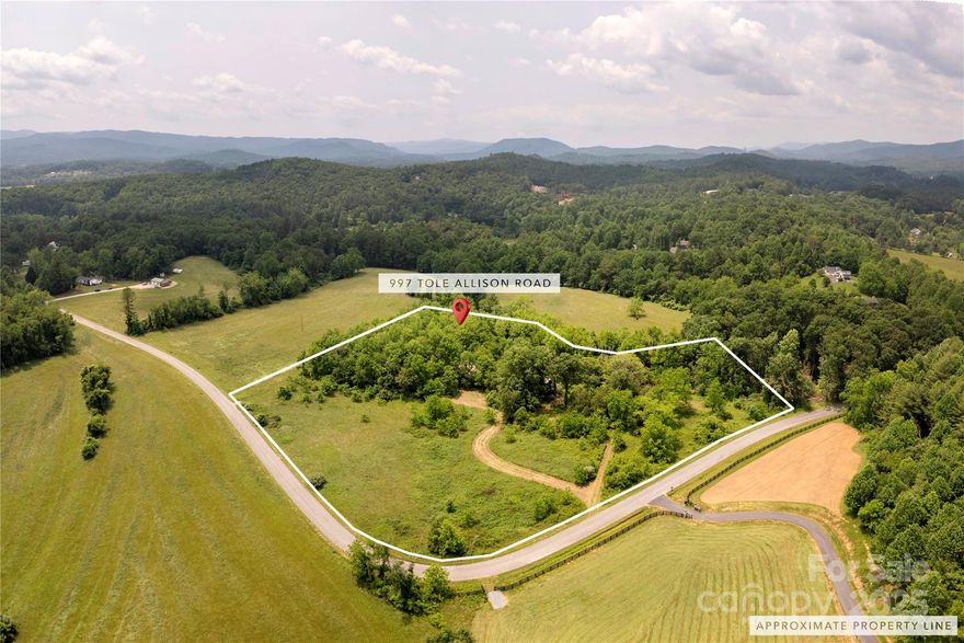 Discover this rare opportunity to own 10 picturesque acres in Hendersonville—just 7 minutes to Mills River Ingles and 13 minutes to Asheville Regional Airport! This former farmstead offers the perfect blend of privacy, beauty, and location. Gently rolling hills, cleared pastures, and a meandering creek make this property ideal for equestrian use, hobby farming, or creating a serene luxury estate. The land features an old silo and other farm buildings, a nod to its rich agricultural history, and is surrounded by sweeping pastoral views. Located directly across from a beautiful estate, this property is situated in a highly desirable area where privacy meets prestige. A private well is already in place, plus a 3-bedroom septic system with multiple stunning home site options to bring your vision to life. Whether you're seeking a peaceful retreat, a working farm, or an investment in one of Mills River’s most coveted areas, this land is truly one of a kind.