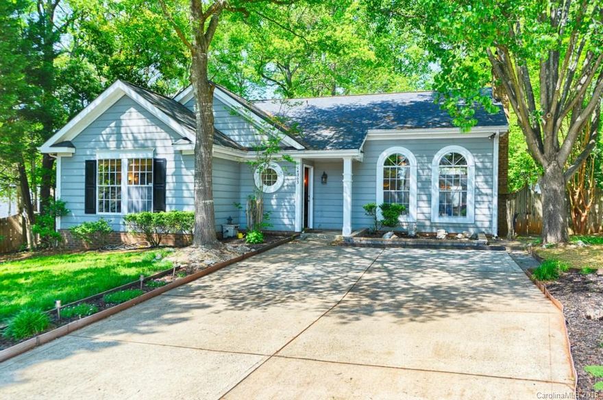 Charming 3 bedroom home with awesome curb appeal situated on a cul-de-sac lot with fully fenced wooded natural backyard. Living Room with ceiling fan, wood floors, palladium windows, crown molding & FP. Dining Room with transom window, chandelier and crown & chair rail molding. Kitchen features granite, ss appliances and tile backsplash. Master BR with tray ceiling, wood floors & WIC. Glass porch with tile floor & hot tub. Stone paths lead to fire pit & storage building in yard.