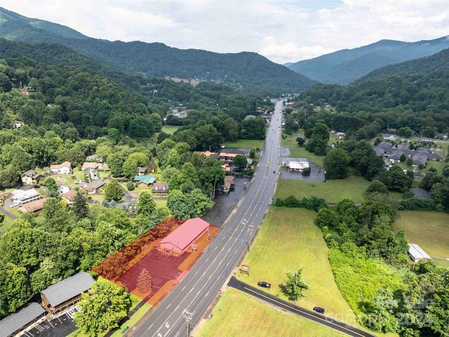 Great commercial opportunity with this 4500 square-foot single level building with over 240 feet of road frontage and beautiful bold Jonathan Creek flowing in the rear. 17 parking places open floor space, 2 bathrooms have been completed, office area, updated insulation and decorative truss ceiling, Sheetrock, electrical, and commercial restaurant vent hood completed all other possible features to be verified. City water & sewer. Joins the very successful Bear Waters Brewing property with many different venue opportunities for this excellent location.