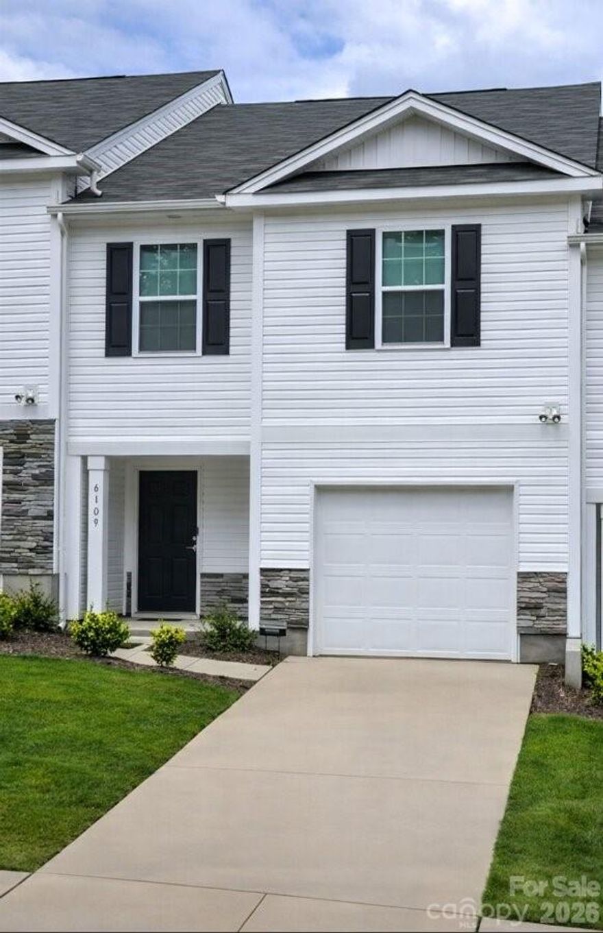 Built in 2024, this modern townhome offers the benefits of newer construction paired with a low-maintenance lifestyle in the Mallard Creek area of Charlotte. Designed with comfort and efficiency in mind, the home features contemporary finishes, a durable vinyl exterior, and thoughtfully planned living spaces.

Inside, the layout is open and functional, with natural light flowing through the main living area, dining space, and kitchen. The kitchen is well-suited for both everyday living and entertaining, while the bedrooms are generously sized and designed to provide privacy and comfort. The primary suite includes a full bathroom and ample closet space. Major systems, including the roof and mechanical components, were installed in 2024 per seller disclosures.

The property is located within Mallard Creek Townes, a planned community with a homeowners association that provides lawn and common area maintenance. This allows residents to enjoy a consistently maintained neighborhood without the responsibility of exterior upkeep. The community is intentionally designed without recreational amenities, keeping the focus on maintenance and long-term care.

This home is currently tenant-occupied under a lease through June 30, 2027, providing immediate rental income. This creates flexibility for a variety of ownership goals, whether securing a future primary residence while collecting rent in the interim, expanding an existing investment portfolio, or entering the rental market with an established tenant already in place.

Covenants and restrictions apply, including architectural guidelines, single-family residential use, and limitations on short-term rentals. The overall structure supports a stable, residential environment.

Conveniently situated near shopping, dining, employment centers, and major commuter routes, this property offers a balance of accessibility, modern construction, and reduced maintenance responsibilities.