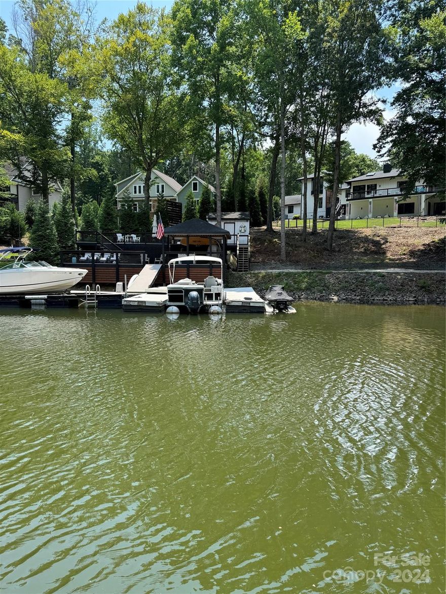 Incredible Rare opportunity to own 8 + acres on Lake Norman with deeded Trex Dock in place and ready to use. Great swim water in the private quite cove in Terrell Nc. Less than 2 miles to Mooresville. On the corner of Holdsclaw Rd & Kiser Island Rd. This is unrestricted with no HOA's so Build your dream Home with Barns & Workshops. This may be able to be subdivided but agents would need to check with county. This consist of 2 parcels for a total of 8.52 acres. Parcel ID 461711668166 & 461711752901
Lot was perked for a 4 bedroom septic system but could probably get more rooms if needed .. Don't wait or this will be GONE..