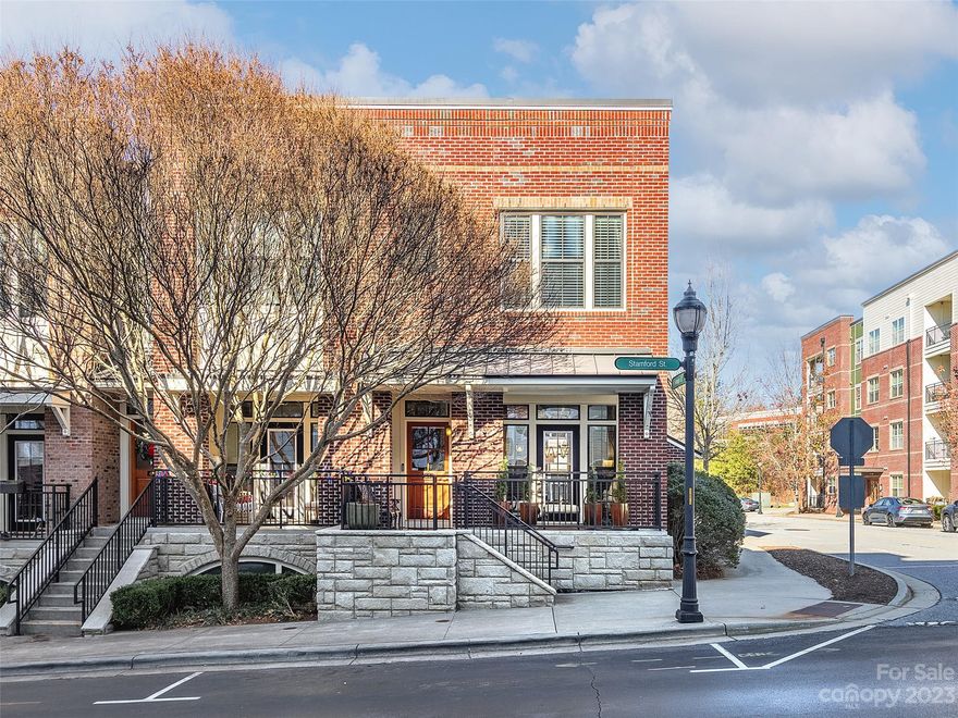 Exquisite brownstone condo in the heart of Biltmore Park. This rare end-unit features a multitude of windows that bring in lots of natural light. High ceilings, rich moldings, & wood floors lead to an attractive kitchen w/ granite & stainless. Trex deck affords mountain views. Cozy balcony at the front. Two spacious bedrooms upstairs feature walk-in closets & the primary has an inviting bath with granite vanity and tiled shower. Lower level houses the one car garage, storage, & a great bonus room with built-in storage closet. Forego the car! Boutique shopping, high-end dining, fitness venues & scenic trails are all at your fingertips!