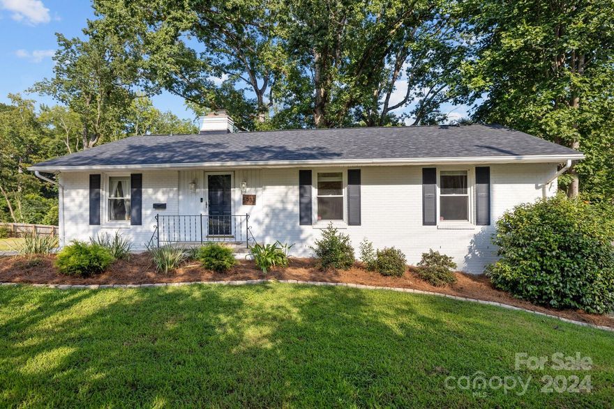 Charming brick ranch located on a cul-de-sac in Charlotte's coveted Madison Park. This beautifully updated home features neutral paint, gleaming wood floors and cozy wood-burning fireplace with brick surround. Kitchen boasts white Shaker cabinets, subway tile backsplash, granite counters and stainless appliances. Adjacent dining area, living room and sunroom that offers plentiful natural light. Primary bedroom with ensuite that has a tiled shower with frameless glass. There are two additional beds and full bath. Basement is heated/cooled and provides an additional 693 sq. ft. of versatile space suitable for an office, workout area, playroom or any purpose you desire. Outbuilding with split system offers endless possibilities. Fully fenced backyard is an entertainer's dream with expansive deck, patio and spacious, tree-lined lot. Ideally located near Park Road Shopping Center, Montford, SouthPark, South End, Greenways and parks. Roof in 2024. No HOA. Currently zoned for Myers Park HS.