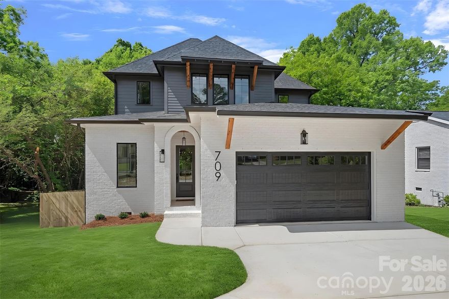 Brand new construction where thoughtful design and elevated finishes come together seamlessly. From the moment you arrive, the striking architectural presence sets the tone, highlighted by a welcoming arched entry and curated exterior details.

Inside, the home immediately impresses with a herringbone-patterned entry and solid white oak floors that carry throughout. A private front office offers the perfect work-from-home retreat, while a color-drenched powder room adds a bold, designer touch. The main living space is both refined and inviting, centered around a sleek gas fireplace and designed for effortless flow.

The gourmet kitchen is a true centerpiece, featuring an oversized island, quartz countertops, striking tiled backsplash, and soft-close cabinetry, all complemented by thoughtfully selected lighting. It opens naturally into a sunlit dining area and extends to a covered back patio, creating an ideal setting for everyday living and entertaining. A custom drop zone just off the garage adds function without sacrificing style.

Upstairs, the primary suite is a true retreat, offering a spa-inspired bath with dual vanities, a soaking tub, and an oversized Carrara marble shower complete with bench seating and dual niches, along with a custom walk-in closet. Two additional guest bedrooms are generously sized and share a well-appointed bath with dual vanity.

The fully fenced backyard offers exceptional privacy and space, surrounded by mature trees and situated on a generous lot with no HOA—perfect for relaxing, entertaining, or future outdoor enhancements.

Completing the home is a two-car attached garage, a rare find in this area, offering ample parking and valuable storage.

Ideally located in one of Charlotte’s fastest-growing areas, just minutes from Camp North End, NoDa, Optimist Hall, and Uptown, offering easy access to some of the city’s best dining, breweries, and entertainment.
