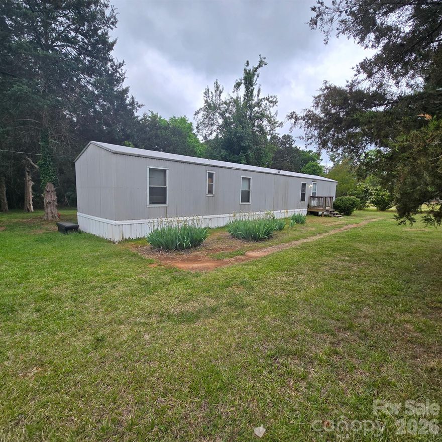 Rare opportunity in the highly desirable Lake Wylie area! Situated on nearly 2 acres, this corner lot offers endless potential for those looking to build their dream home or invest in a growing area.
The property currently features an existing well and septic—providing a strong starting point for future plans. Whether you choose to enjoy the property as-is, renovate, or build new, the value here is in the land and location.
Hard-to-find acreage with road frontage in this area, plus zoning for the new high school makes this an even more attractive opportunity. Opportunities like this—with acreage, utilities in place, and location—are becoming increasingly rare in Lake Wylie.